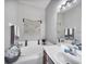 Bright bathroom featuring a soaking tub, vanity, and decorative accents at 3826 Virga Blvd, Sarasota, FL 34233