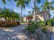 Charming community building entrance with beautiful landscaping and a well-maintained walkway at 3826 Virga Blvd, Sarasota, FL 34233