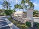 Elegant stone sign at the entrance to Parkstone community with lush greenery at 3826 Virga Blvd, Sarasota, FL 34233