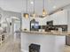 Modern kitchen with granite countertops, stainless steel appliances, and convenient access to the living area at 3826 Virga Blvd, Sarasota, FL 34233