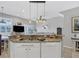 Beautiful kitchen featuring granite counters, pendant lighting, and stainless steel appliances at 3826 Virga Blvd, Sarasota, FL 34233
