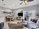 Spacious living area featuring tile flooring, a dining area, and access to a screened outdoor patio at 3826 Virga Blvd, Sarasota, FL 34233