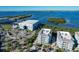 Aerial view showcases the building's prime location, marina, and waterfront views at 396 Aruba Cir # 302, Bradenton, FL 34209