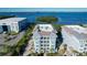 Aerial view highlights the building's design and proximity to the waterfront and the marina at 396 Aruba Cir # 302, Bradenton, FL 34209