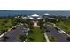 Aerial view of a stunning waterfront property with lush landscaping and ample parking at 396 Aruba Cir # 302, Bradenton, FL 34209