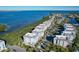 Beautiful aerial view of waterfront condos with stunning bay views and lush landscaping at 396 Aruba Cir # 302, Bradenton, FL 34209