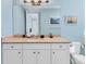Bathroom featuring a vanity with granite countertops and nautical decor at 396 Aruba Cir # 302, Bradenton, FL 34209