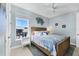 Bedroom featuring a bed with colorful covers, a ceiling fan, and a window at 396 Aruba Cir # 302, Bradenton, FL 34209