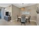 Bright dining area featuring stylish lighting and a table with comfortable seating for four at 396 Aruba Cir # 302, Bradenton, FL 34209