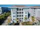 Gorgeous condo exterior featuring private balconies, lush landscaping, and coastal charm at 396 Aruba Cir # 302, Bradenton, FL 34209