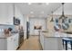Modern kitchen features stainless steel appliances, white cabinetry, and an open layout at 396 Aruba Cir # 302, Bradenton, FL 34209