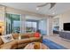 Inviting living room with access to the screened balcony, comfortable seating and lovely decor at 396 Aruba Cir # 302, Bradenton, FL 34209
