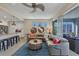 Cozy living room with modern furniture, a ceiling fan and an open floor plan to the kitchen at 396 Aruba Cir # 302, Bradenton, FL 34209