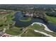 Beautiful aerial view of the golf course community and the surrounding lush Florida landscape at 4416 Calle Serena, Sarasota, FL 34238