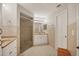 Well-lit bathroom featuring tiled floors, walk-in shower, and dual sinks at 4416 Calle Serena, Sarasota, FL 34238
