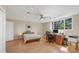 A bright, airy bedroom with a ceiling fan, lots of natural light and space for a home office at 4416 Calle Serena, Sarasota, FL 34238