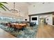 Bright dining room with large windows, modern lighting, and plenty of seating at 4416 Calle Serena, Sarasota, FL 34238