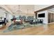Large dining room with modern light fixtures and multiple tables and chairs at 4416 Calle Serena, Sarasota, FL 34238