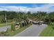 Community entrance with palm trees, signage, and manicured landscaping at 4416 Calle Serena, Sarasota, FL 34238