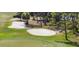 Aerial view of a golf course with sand traps, green and an eagle flying over at 4416 Calle Serena, Sarasota, FL 34238