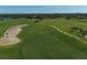 Scenic aerial view of the well-maintained golf course fairways and sand traps at 4416 Calle Serena, Sarasota, FL 34238