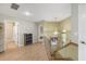 Well-lit hallway with wood floors and chandelier at 4416 Calle Serena, Sarasota, FL 34238