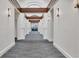 Bright hallway with decorative lighting and neutral color scheme at 4416 Calle Serena, Sarasota, FL 34238