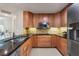 Updated kitchen with granite countertops, stainless steel appliances, and lots of storage at 4416 Calle Serena, Sarasota, FL 34238