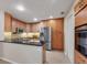 Well-equipped kitchen featuring granite countertops, stainless steel appliances, and ample cabinet space at 4416 Calle Serena, Sarasota, FL 34238
