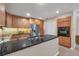 Modern kitchen with stainless steel appliances, granite countertops, and abundant cabinetry at 4416 Calle Serena, Sarasota, FL 34238
