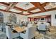Elegant dining room with stylish chairs, tables, and well stocked bar, perfect for social gatherings and meals at 4416 Calle Serena, Sarasota, FL 34238