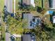 Aerial view of a property with a pool and tree coverage highlighted in a red rectangle at 4461 Maceachen Blvd, Sarasota, FL 34233