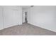 Bedroom with neutral carpet, closet, and bright natural light at 4461 Maceachen Blvd, Sarasota, FL 34233