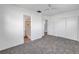 Spacious carpeted main bedroom with ensuite bathroom and closet space at 4461 Maceachen Blvd, Sarasota, FL 34233