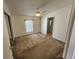 Cozy bedroom with ceiling fan, window, and a mirrored closet, offering ample space at 4923 5Th Street W Ct, Bradenton, FL 34207