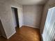 Bedroom with light colored walls and wood look flooring at 4923 5Th Street W Ct, Bradenton, FL 34207