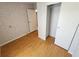 Bedroom features wood flooring and closet at 4923 5Th Street W Ct, Bradenton, FL 34207