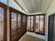Covered patio with bright, natural lighting and bamboo blinds at 4923 5Th Street W Ct, Bradenton, FL 34207