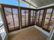 Enclosed patio space with bamboo blinds at 4923 5Th Street W Ct, Bradenton, FL 34207