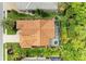 Aerial view of the home and backyard featuring a screened-in pool and lush landscaping at 5308 88Th E St, Bradenton, FL 34211