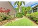 Lush backyard landscaping with verdant lawn offers a private outdoor retreat at 5308 88Th E St, Bradenton, FL 34211