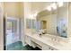 The expansive bathroom features double sinks and ample vanity space for a luxurious experience at 5308 88Th E St, Bradenton, FL 34211