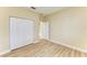 Bedroom features plank flooring, neutral paint, and double closet at 5308 88Th E St, Bradenton, FL 34211