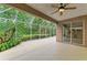 Relaxing covered patio with outdoor kitchen and access to the screened-in lanai at 5308 88Th E St, Bradenton, FL 34211