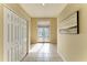 Inviting hallway featuring tile flooring and double doors to the entrance at 5308 88Th E St, Bradenton, FL 34211