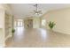 Bright living room with tile flooring, neutral paint, and natural light from the windows at 5308 88Th E St, Bradenton, FL 34211