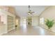 An open living room with vaulted ceilings, and tile flooring, with natural light at 5308 88Th E St, Bradenton, FL 34211
