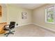 Home office with built-in desk, neutral paint, tile flooring, and natural light at 5308 88Th E St, Bradenton, FL 34211