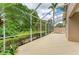 Lush landscaping surrounds the screened lanai, which also features an in-ground hot tub at 5308 88Th E St, Bradenton, FL 34211