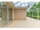 A spacious screened patio is a versatile space perfect for outdoor dining, lounging, and entertaining guests at 5308 88Th E St, Bradenton, FL 34211